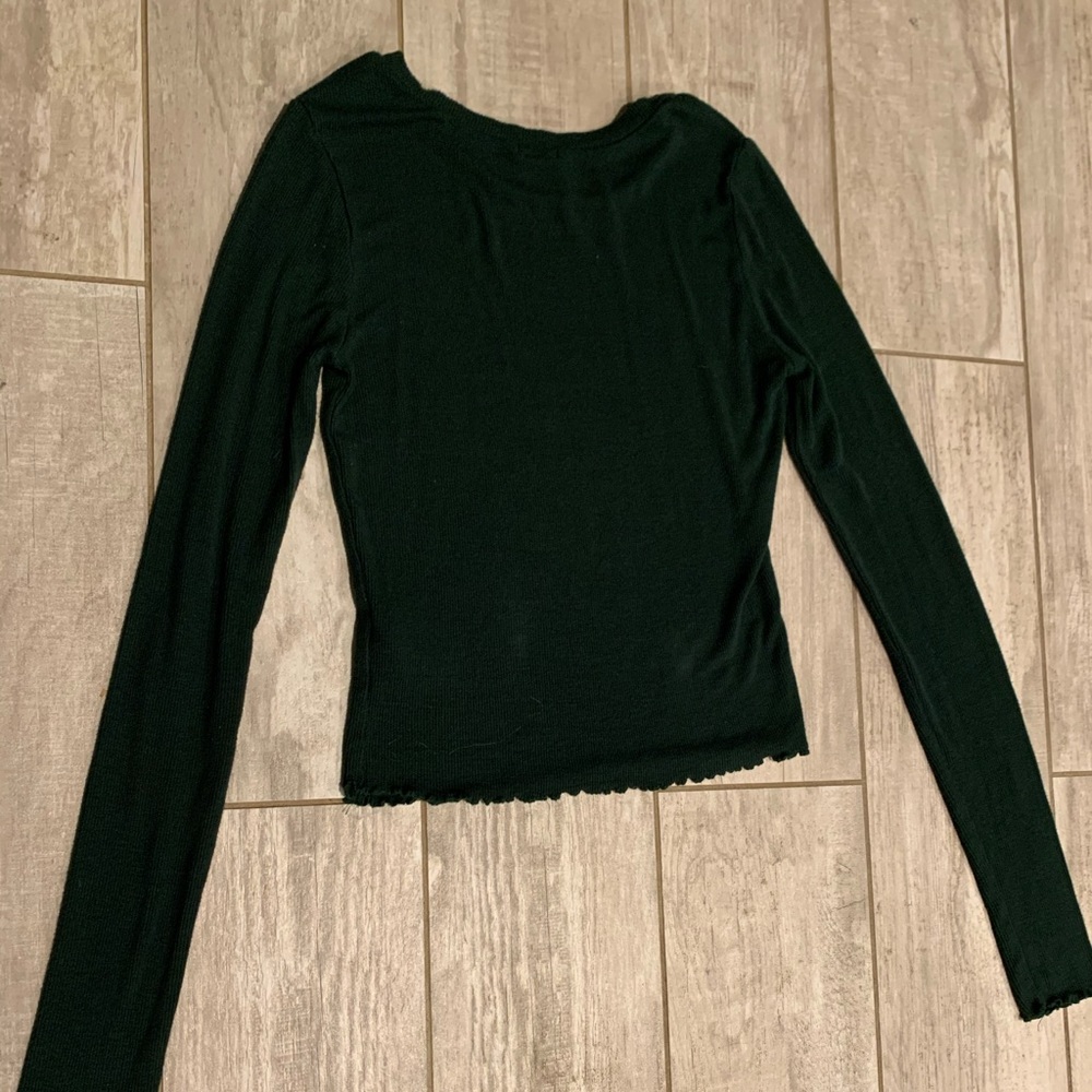 Forest green, tight fitting shirt
